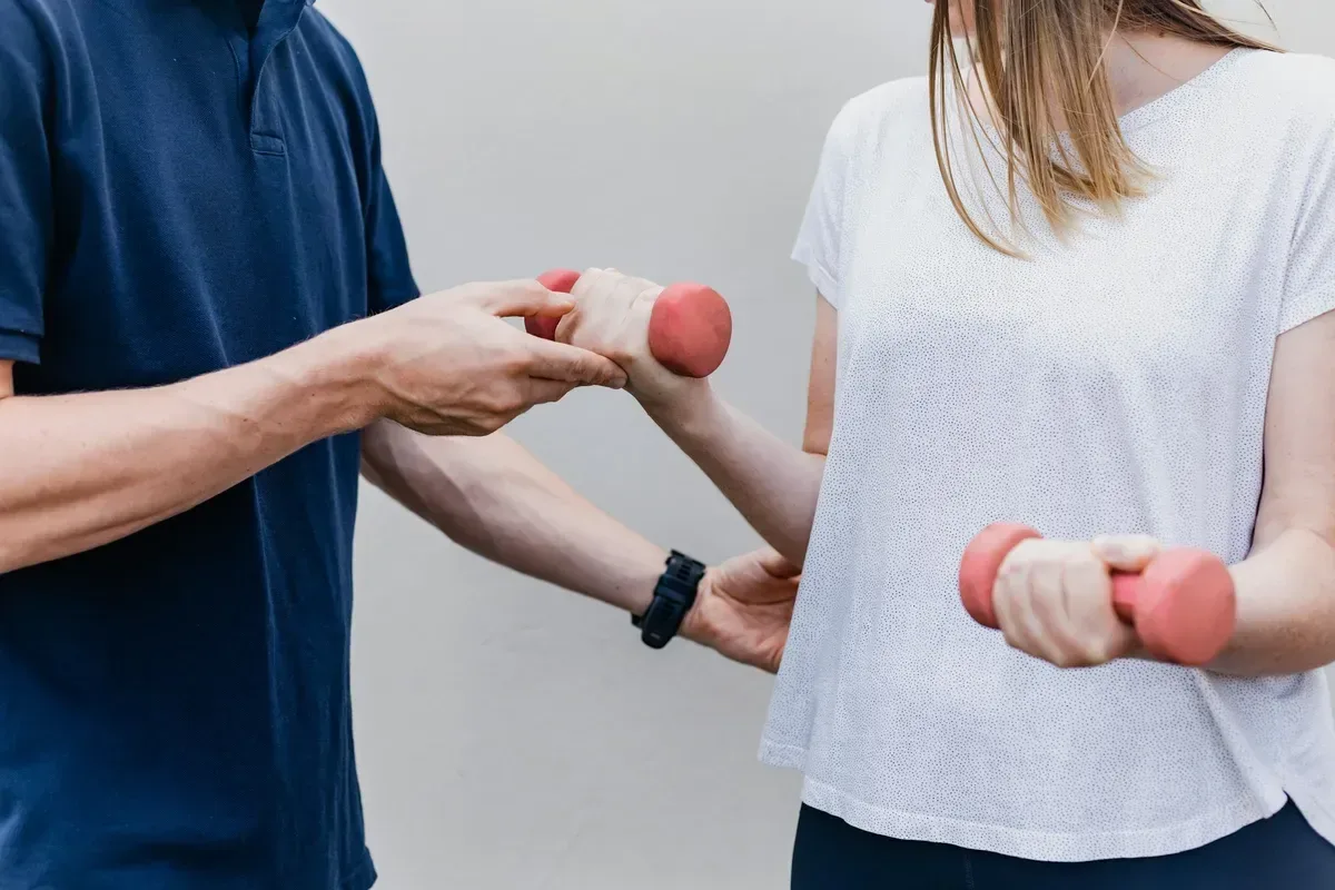 A person in physiotherapy recovery, dignified and actively working toward returning to work.