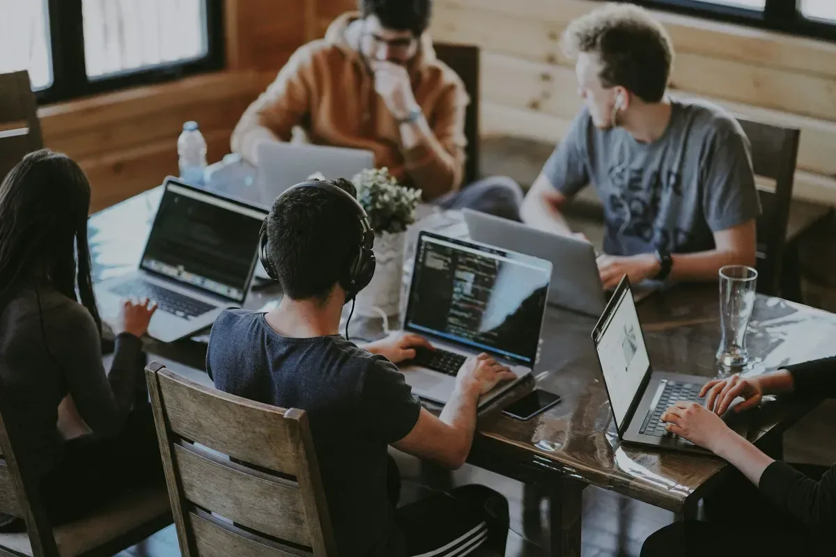 A diverse small-business team collaborating together in an office.