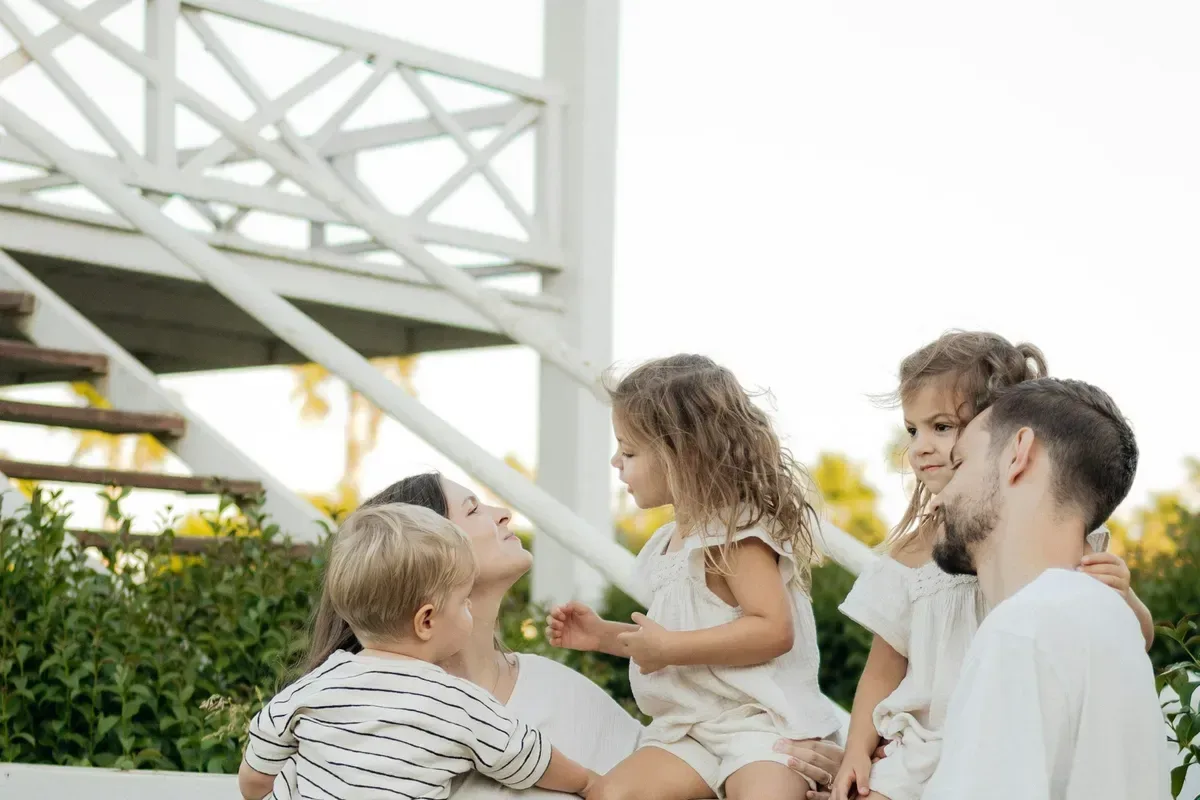 A multigenerational family together at home, representing lifelong protection and legacy.